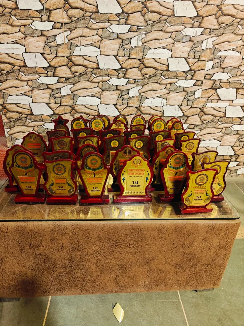 Trophies laid out ready for presentation at Shanti Niketan Inter College