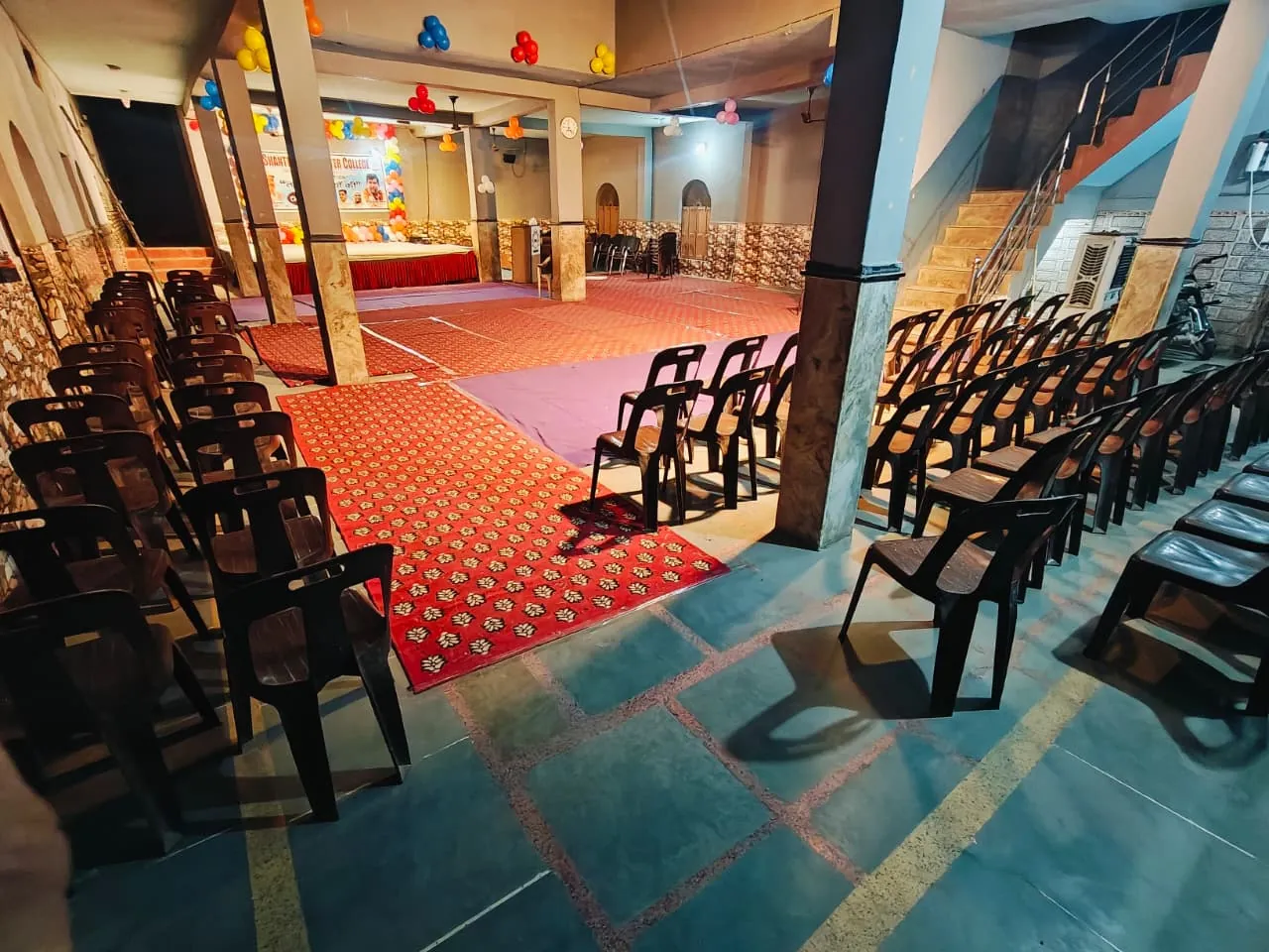 Seating arranged in the school hall for an educational event
